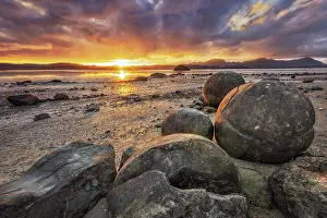 Boulders: Koutu Boulders with sun star at sunset, Opononi