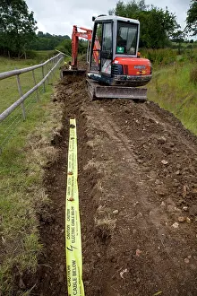Machinery: Kubota Digger - filling in trench with electric