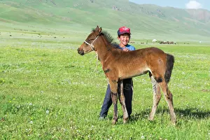 Custom: Kyrgyz boy with his foal, Song Kol Lake, Naryn province