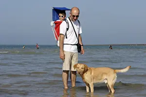 Preventions: Labrador and his owner at the seaside Normandy France