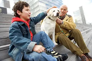 Stroking: Labrador - sitting on steps with man and boy