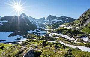 Reflex: Lake Isvatnet with ice, mountains and snow, mountain