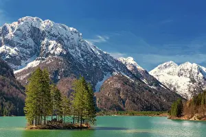 Giulia: Lake Raibl with small tree island, snow-capped mountains