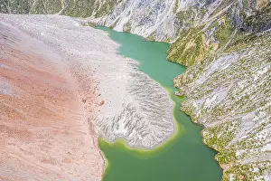 Highway: Lake with sandbank, dead trees, crater rim of Chaiten