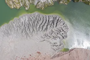 Highway: Lake with sandbank, dead trees, crater rim of Chaiten
