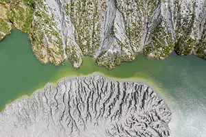 Highway: Lake with sandbank, dead trees, crater rim of Chaiten