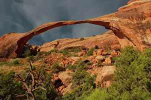 Devils: Landscape Arch at sunrise and approaching thunderstorm