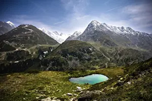 Peaks: Landscape with a mountain lake and snow-capped peaks