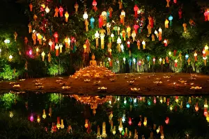 Candles: Lanterns and candles reflected in a pool with a