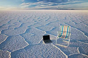 Laptop: Laptop computer and beach chair standing in salt pan