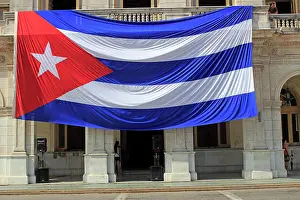 Pride: Large Cuban flag, hangs from building, Santa Clara