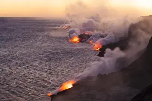 Smoke: Lava from the Kalapana Lava Flow cools as it fl