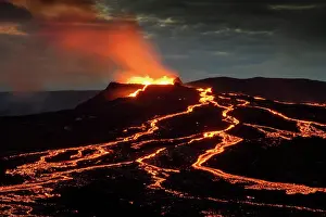 Spurting: Lava spurting out of crater and reddish illuminated