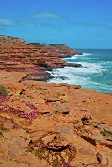 Bluff: Layered cliffs of red rock rise up from