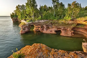 Devils: Layered sandstone cliffs and sea caves at