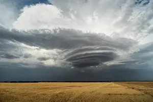 Warmth: Lenticular cloud in a thunderstorm. Lenticular cloud