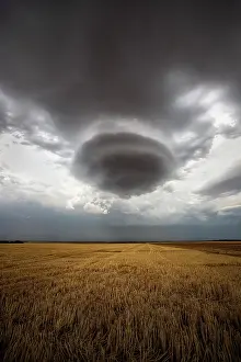 Warmth: Lenticular cloud in a thunderstorm. Lenticular cloud