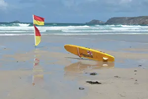 Paul Felix: Lifeguards Surfboard and warning flags on beach