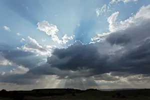 Streaming: Light beams streaming through clouds, Maasai