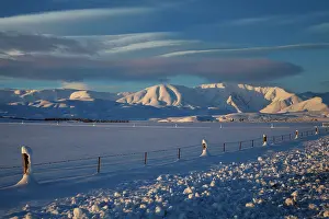 Altocumulus: Last light on snowy farmland and Hawkdun