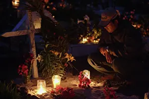 Township: Lighted candles in the cemetery (on All SaintsI