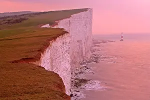 Beachy: Lighthouse at Beachy Head and steep chalk cliffs at sunrise