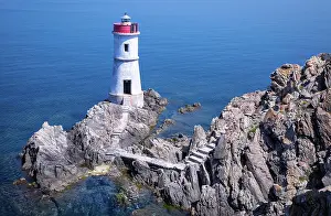 Steep: lighthouse against the blue sea