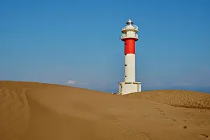 Fangar: Lighthouse Far del Fangar on sandy dunes, beach
