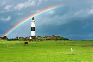 Prismatic: Lighthouse in Kampen with a rainbow shortly after