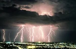 Storms: Lightning: cloud to ground bolts strike near Three