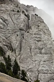 Vercors: Limestone Cliffs with swirling mist Mont Aiguille