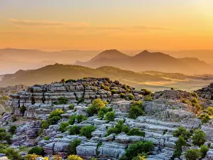 Erode: Limestone rock formations at sunset, El Torcal nature