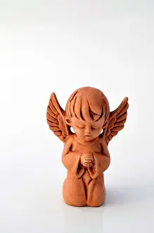 Made: Little angel made of clay, praying
