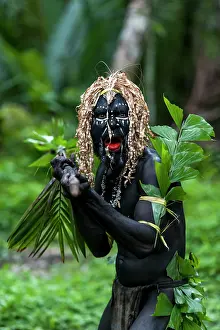 Wigs: Local Dancer man painted with black paint performing