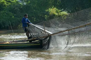 Brian Mcdairmant: Local man using net fixed to front of the boat
