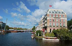 Canals: Local working boats on the canals in Amsterdam