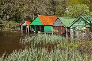 Stirling: Loch Ard - colourful wooden boat houses along the