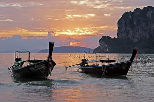 Boats: Long tailed boats at sunset on West Railay Beach, Krabi, Thailand