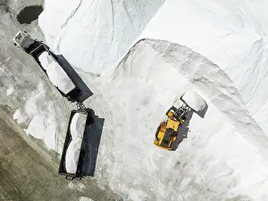 Lorry: Lorry and excavator at the salt heaps of the Walvis Bay Salt works