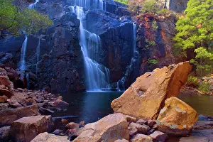Plunge: Mac Kenzie Falls - water cascades down red cliffs