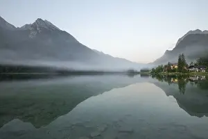 Misty: Magical sunrise with fog at Hintersee near Ramsau in Berchtesgadener Land