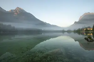 Misty: Magical sunrise with fog at Hintersee near Ramsau in Berchtesgadener Land
