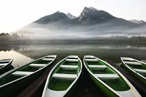 Boats: Magical sunrise with fog at Hintersee near Ramsau in Berchtesgadener Land