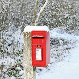 Postbox: Mailbox on post covered in snow