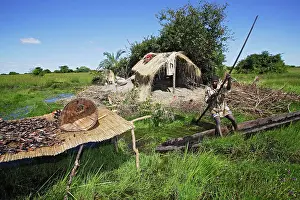 Catfishes: Man - fishing from boat in Bangweuleu Marsh, with
