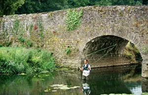 Anglers: Man FISHING - for Trout near bridge