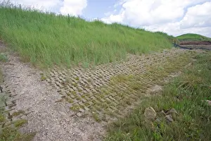 Floods: Man made flood defence wall salt marsh