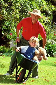 Wheelbarrow: Man with girl in wheelbarrow