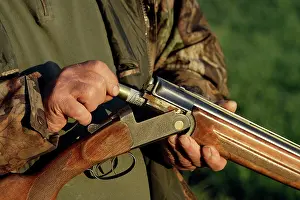 Guns: Man - loading gun for hunting small game