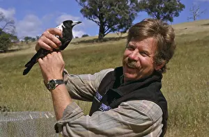 Handler: Man with magpie, Australia